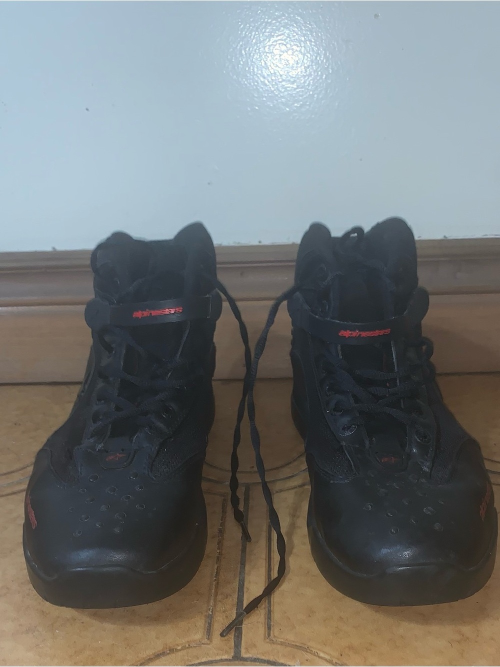 Alpinestars Black High-Top Motorcycle Boots with Red Accents